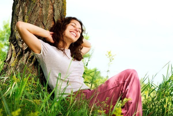 Beautiful Young Woman Relaxing outdoors. Nature